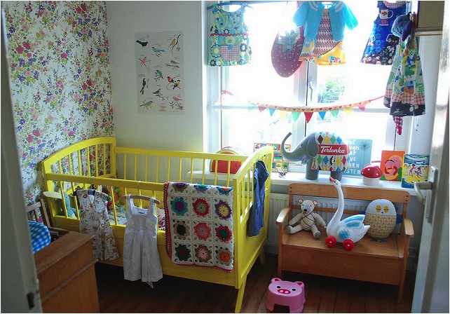 "yellow vintage baby nursery room"