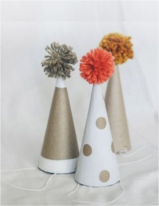 "DIY pompom kids party hats"